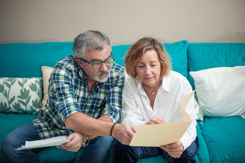 By withdrawing more than the minimum from their RRIFs, is a retired Alberta couple outspending their portfolio?